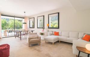 a living room with a white couch and a table at Ternelles in Pollença