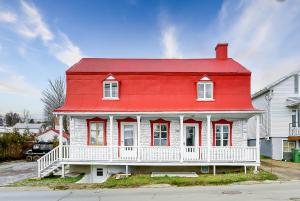 a red and white house with a red roof at Le Toit Rouge - 3457 in Saint-Férréol-les-Neiges