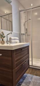 a bathroom with a sink and a shower at Apart Antonius in Pfunds +52 photos