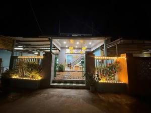 a front door of a building at night at Con Cua Biển Homestay in Tuy Hoa