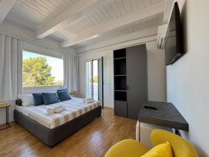 a bedroom with a bed and a large window at ItineraBaiaVerde Rooms & Breakfast in Gallipoli