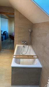 a large bath tub in a room with a room at Apartment Büel in Krattigen in Krattigen