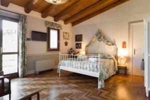 Postel nebo postele na pokoji v ubytování Casa Il Borghetto - Luxury Suites & Pool