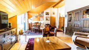 a living room with a couch and a table at Holidayapartment Kirchweg, Glis in Brig