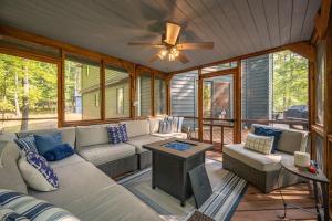 a screened in porch with a couch and a table at Black Bear Lodge by Railey Vacations in Oakland +46 photos