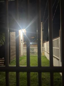 a view of the sun shining through a window at Kit luxo com spa aquecido in Florianópolis