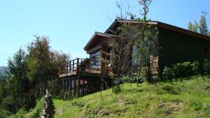 a house on the side of a hill at Cabañas Vasconia in Castro
