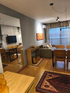 a living room with a couch and a table at Premium Apartment in Bagé in Bagé
