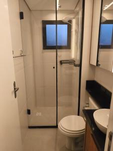 a bathroom with a shower and a toilet at Premium Apartment in Bagé in Bagé