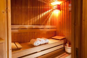 a sauna with three rolls of towels in it at Ambra Hotel in Budapest