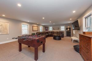 a large living room with a pool table at Wake Up Grateful by Railey Vacations in Swanton
