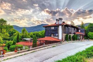 a house on the side of a road at Hotel Smilen in Smolyan