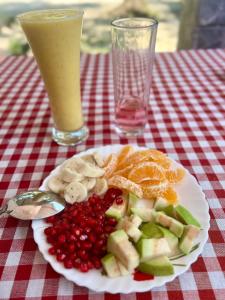 a plate of food on a table with a drink at Azriel marari in Mararikulam +19 photos