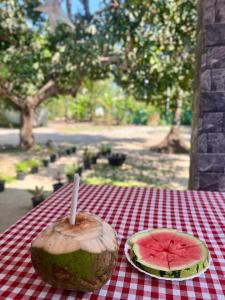 a watermelon cut in half sitting on a table at Azriel marari in Mararikulam