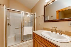a bathroom with a sink and a shower at Viva By The Stream by Railey Vacations in McHenry +24 photos