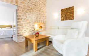 a living room with a white couch and a table at Na Mikeleta in Capdepera +29 photos