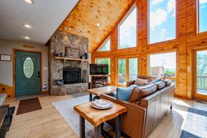a living room with a couch and a fireplace at The Cozy Perch by Railey Vacations in Oakland