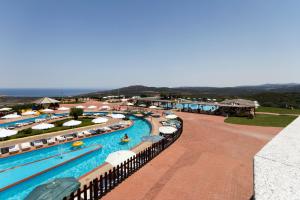 an aerial view of a pool at a resort at Aquafantasy rooms in Isola Rossa +16 photos