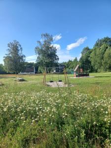 an empty park with a playground in a field at Central functional apartment with short distance to everything in Sandefjord