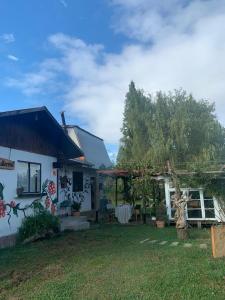 a house with graffiti on the side of it at Casa Berries in Colbún