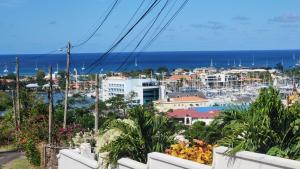 a view of a city from a balcony at Hilltop Villa Chez Coco in Rodney Bay Village