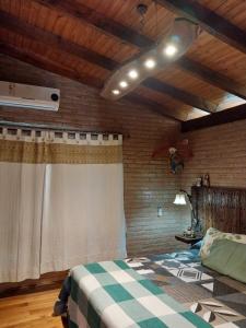a bedroom with a bed with a checkered blanket at soy ahora segunda in San Javier +14 photos