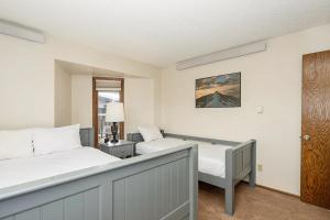 a bedroom with two beds and a window at Cozy Corner in Winter Park +13 photos