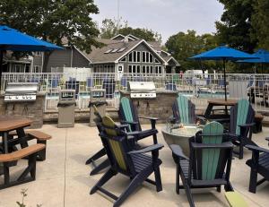 a patio with chairs and tables and a pool at Waterbury Inn in Ephraim +7 photos
