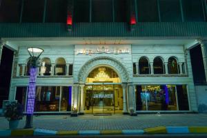 a store front with a light pole in front of it at Jawaher hotel in Karbala