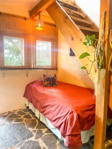 a small bed in a room with a staircase at Granja Tzikin in Tzununá +26 photos