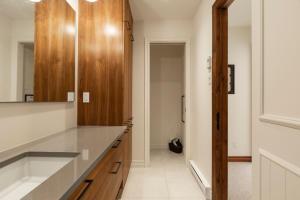 a bathroom with a sink and a mirror at Lake view - Ski In-Out in Mont-Tremblant +58 photos