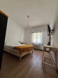 a bedroom with a bed and a window and a ladder at Agriturismo Cà da Nonna Rosa in Neirone