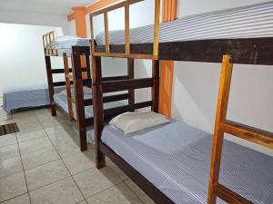 a couple of bunk beds in a room at São Luís Hostel - Dormitórios Compartilhados e Quartos Privativos in São Luís