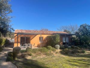 a small orange house with a garden in front of it at La Villa d Isa in La Motte +5 photos