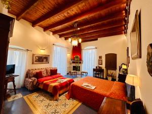 a bedroom with a bed and a couch in a room at VinsLounge Suite in Barletta