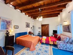 a bedroom with a bed and a couch at VinsLounge Suite in Barletta +73 photos