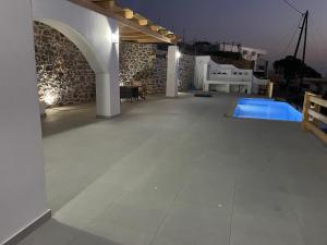 a large room with a pool in a building at Shaunagh's Place in Kalymnos