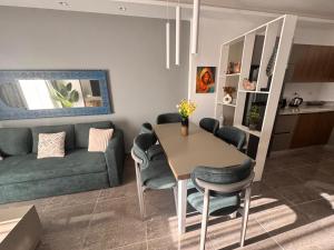 a living room with a table and a couch at Sharm Sea View - Sunny Beach in Sharm El Sheikh