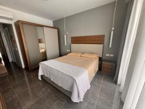 a bedroom with a bed and a mirror at Sharm Sea View - Sunny Beach in Sharm El Sheikh +13 photos