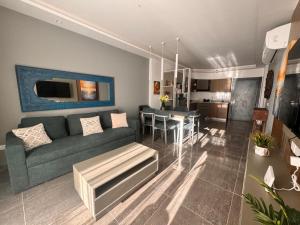 a living room with a couch and a table at Sharm Sea View - Sunny Beach in Sharm El Sheikh