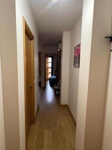 a hallway of a room with a door and a room with a hallway at Ático Centro in Socuéllamos