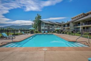 a swimming pool at a apartment complex with a resort at Base Camp for all of Sandpoint and Lake Pend Oreille Adventures in Sandpoint