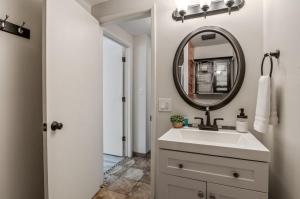 a bathroom with a sink and a mirror at Base Camp for all of Sandpoint and Lake Pend Oreille Adventures in Sandpoint +24 photos