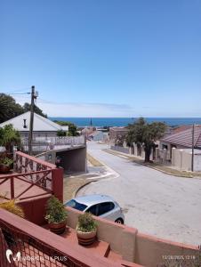 a car parked in a parking lot on a street at Seaview Serenity in Gqeberha