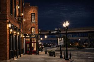 a city street at night with a one way sign at Brick & Bed Riverfront Lofts, T 401 in Saint Louis