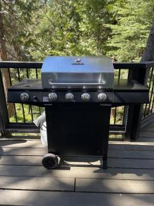 a grill sitting on a table on a patio at The Little Dipper Cabin in Shaver Lake