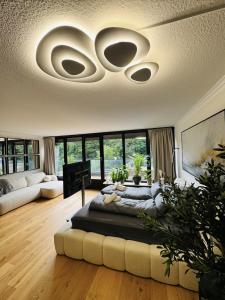 a living room with a large bed in the middle at Velmora Boutique Suites - Wellness - Pool, Sauna, E-Bikes direkt am Strand in Timmendorfer Strand