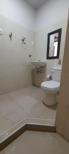 a bathroom with a toilet and a sink at Hotel Cartagena antigua in Cartagena de Indias