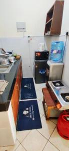 a kitchen with a counter and a stove in it at Shanzu Studio Stamford Apartment in Mombasa