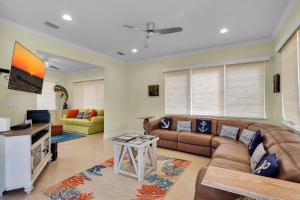 a living room with a couch and a table at Casa Mar in Islamorada